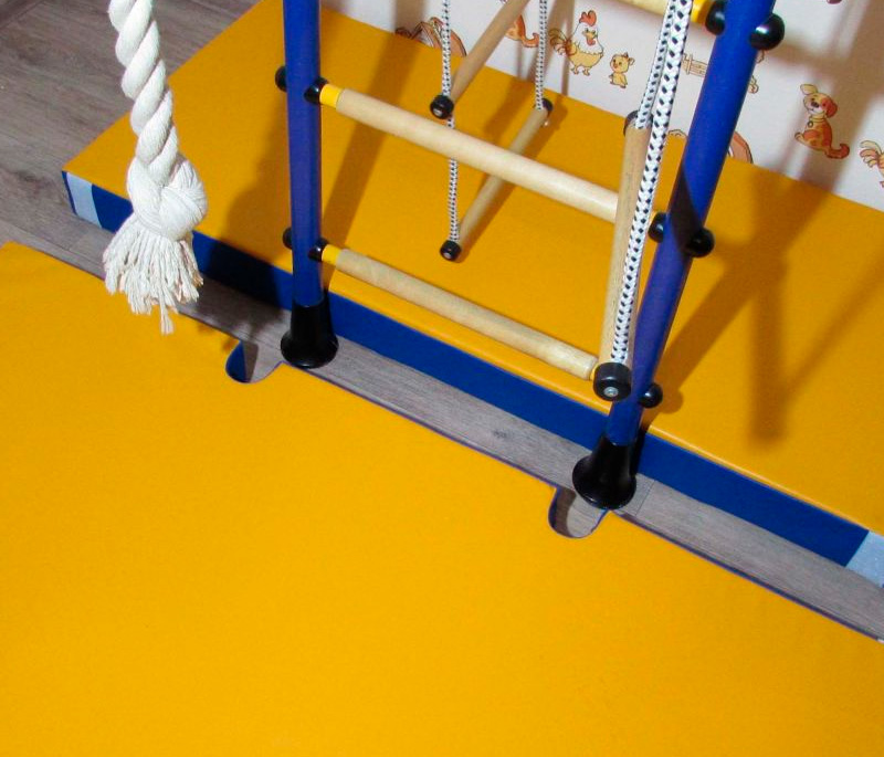 Почему мат обычно не входит в комплект шведской стенки — и как выбрать подходящий